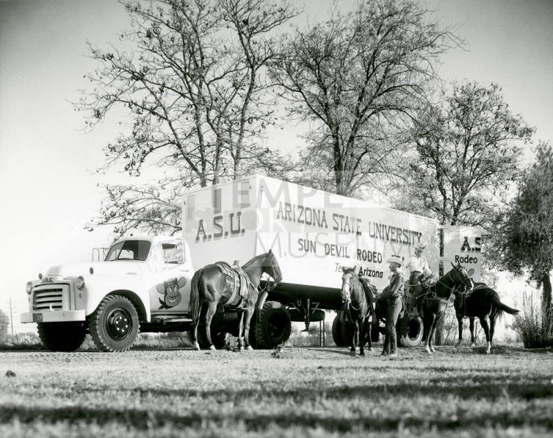 Horses and Riders Standing by an Arizona State University Sun Devil Rodeo Truck