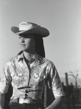 Spectator in Western Garb at the Rodeo