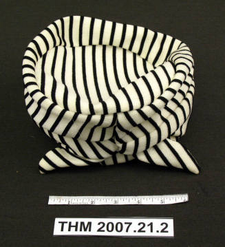 White striped turban-style hat.