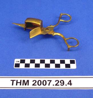 Brass, scissors-style candlesnuffer.