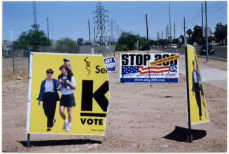Torn Proposition 200 Sign on University Drive in Tempe.