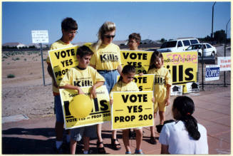 Laura Rocha and her Children with Prop 200 Signs.