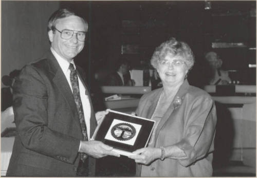 Photo of Harry Mitchell and Pat Hatton with City Seal, 1992.