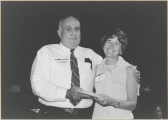 Black and White Photo of Vice Mayor Ben Arredondo Presenting Award to Mary Baroni.
