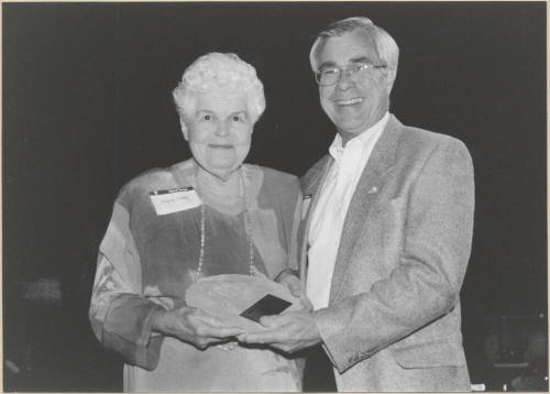 Photo of Virginia Tinsley Receiving Award From Leonard Copple As an Outgoing Member Tempe Municipal Arts Commission, 1999.