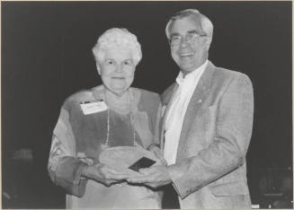 Photo of Virginia Tinsley Receiving Award From Leonard Copple As an Outgoing Member Tempe Municipal Arts Commission, 1999.