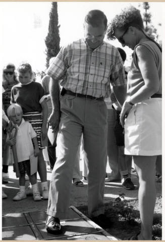 Councilman Don Cassano Making a Cement Footprint During the Grand Opening of the Tempe Historical Museum, Oct. 1991.