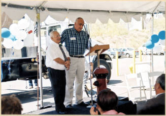 Color photograph of water treatment plant dedication with Johnny Martinez and Ben Arredondo at the podium