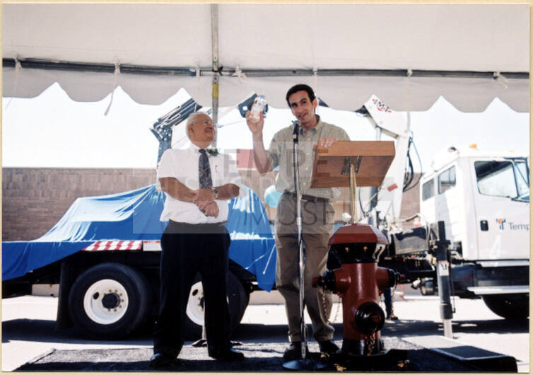 Color photograph of water treatment plant dedication with Johnny Matinez and Mayor Niel Giuliano at the Podium