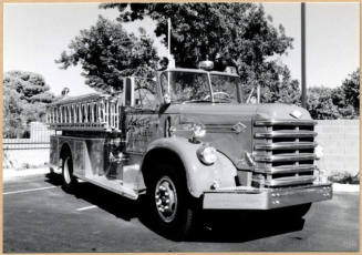 Black and white photograph of vintage fire engine taken at the dedication of Apache Blvd. Fire Station