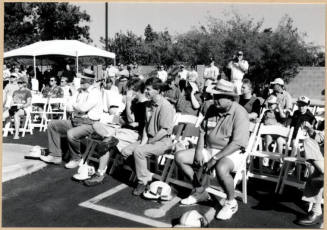 Black and white photograph of audience seated at dedication of Apache Blvd. Fire Station