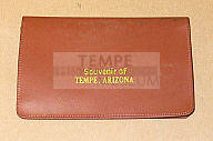 Wallet, Brown vinyl, stamped "souvenir of Tempe, AZ".  Has paper pad, Tom King ID card