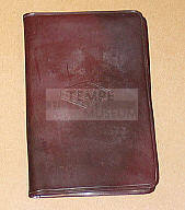 Maroon plastic business card or ID holder from Romney Produce