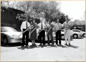 Black and white photograph of Niel Giuliano and other city employees at Tempe's electric Vehicle debut
