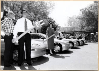 Black and white photograph of Niel Giuliano and other city employees at Tempe's electric vehicle debut