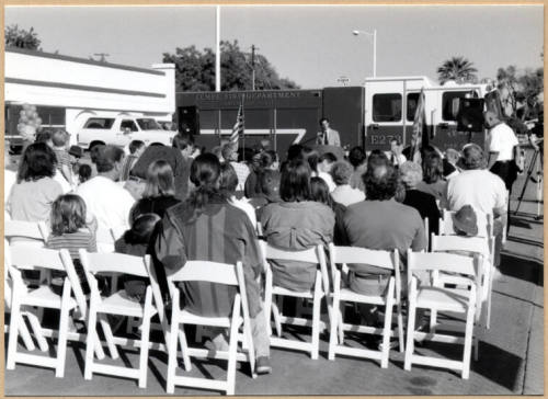 Black and white photograph of Niel Giuliano speaking to a crowd at fire station ground breaking