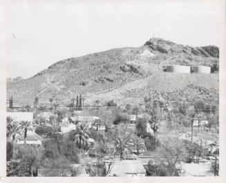 Photograph, looking north to Tempe Butte and 2 water tanks with residential neighborhood in foreground.