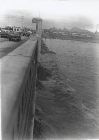 Vertical shot of flooded Salt River from the Mill Avenue Bridge
