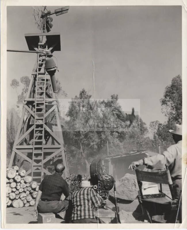 B/W Photo Movie Set with a Windmill, a Falling Man, and a Camera