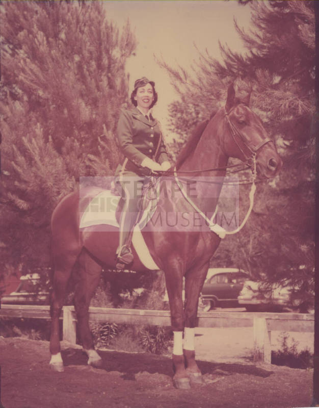 Colorized B/W Photo of a Woman in Uniform on a Horse