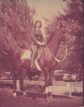 Colorized B/W Photo of a Woman in Uniform on a Horse