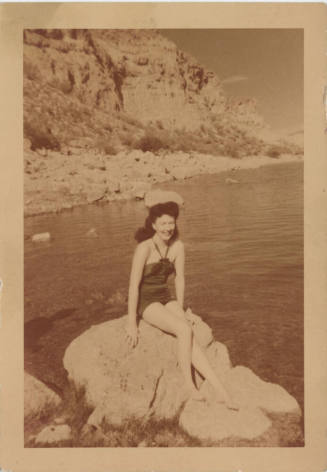 Young Woman in Swimsuit on Rock