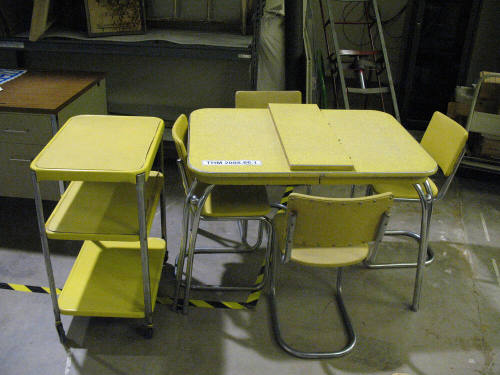 Yellow Formica Kitchen Table with leaf, four Chairs and a Gray Stand on casters