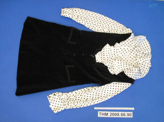 Black velvet jumper with white polka dot blouse