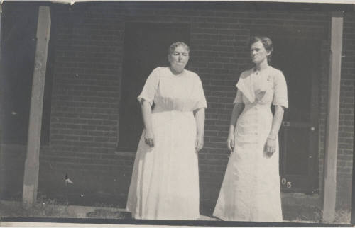 Mary Craig and daughter Estelle on porch of Hackett House