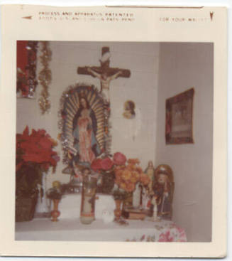 Color Photo:  home altar with Virgin of Guadalupe statue at Ortega home