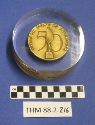 National Safety Council 50 year medal inside a plastic disk