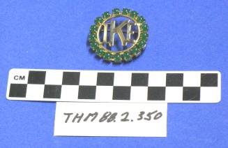 Green "stone" gold circle "Ike" pin