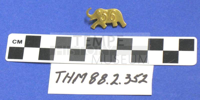 Gold metal "56" elephant pin