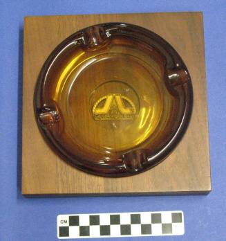 Ashtray, amber glass in wooden base from Arlington, Texas