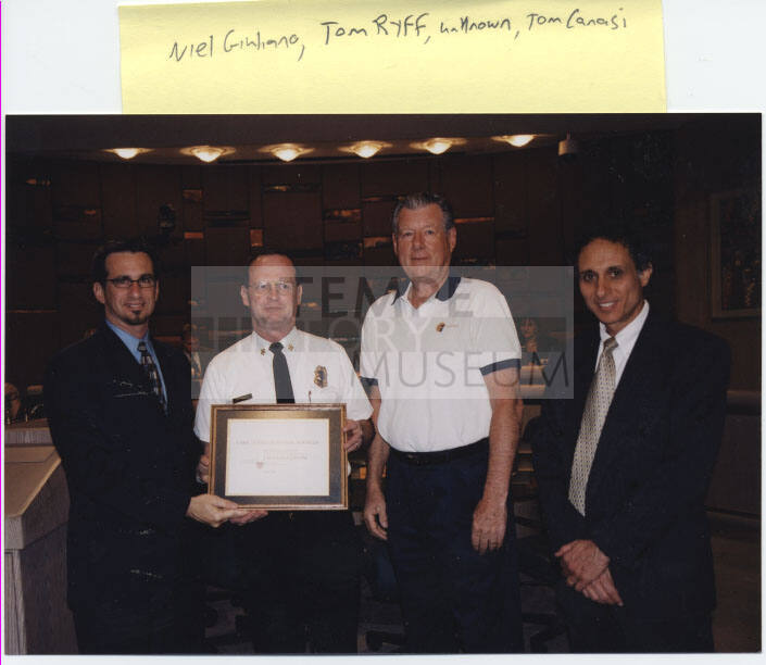 Neil Giuliano, Cliff Jones, a man, Tom Canasi hold award "Care Crisis Response Services Innovation"