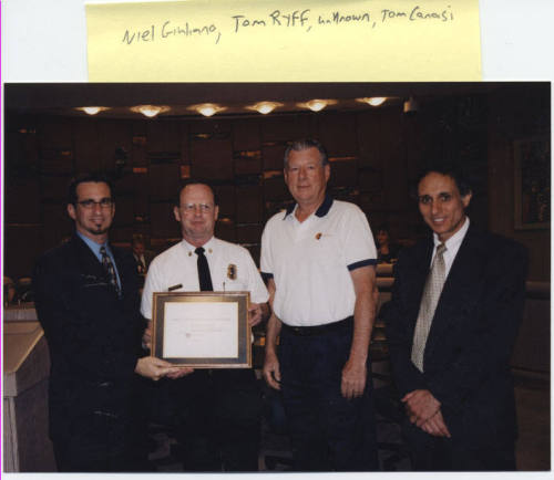 Neil Giuliano, Cliff Jones, a man, Tom Canasi hold award "Care Crisis Response Services Innovation"