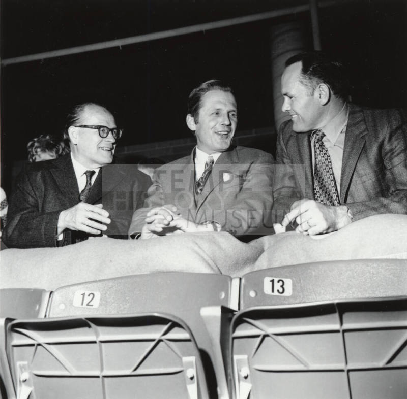 Three Seated Men in Suits, including Mayor Dale Shumway