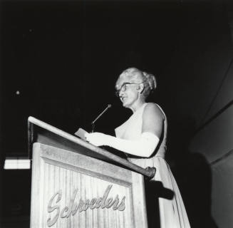 Woman Standing at a Podium