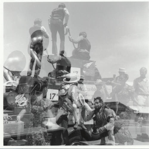 Barehanded Wolfchoker Association Band (double exposure) in the Tempe Centennial Parade
