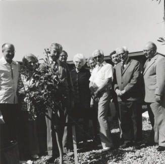 Group of people at a tree planting ceremony, A Lot of Caring