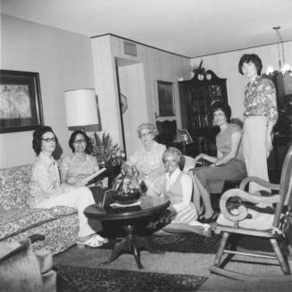 Group of women in a living room.