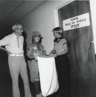 Girl Scout Collecting Cans - May 1977