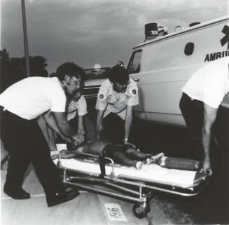 Unidentified EMTs and Ambulance