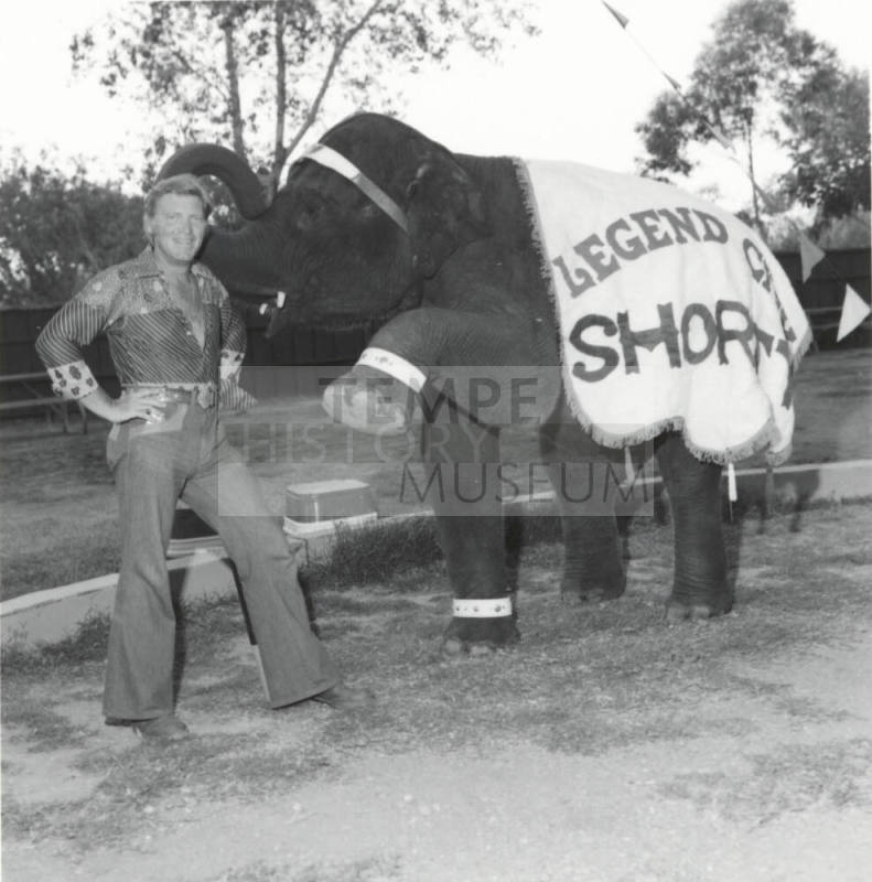 Elephant and trainer at Legend City. - July 1977