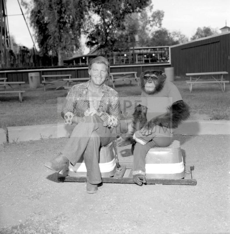 Chimpanzee and trainer at Legend City. - July 1977