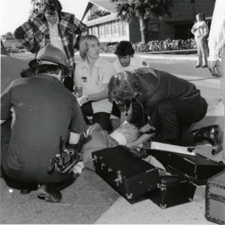 Paramedics assisting a female (1 of 3)