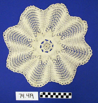 round scalloped crocheted doily