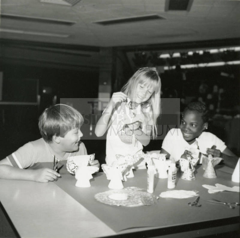 Unidentified children making paper angels