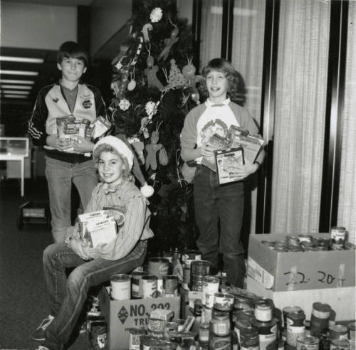 Cans for needy. - Tempe Daily News, December 19 1984