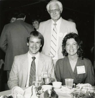 Three Unidentified Individuals at an Event